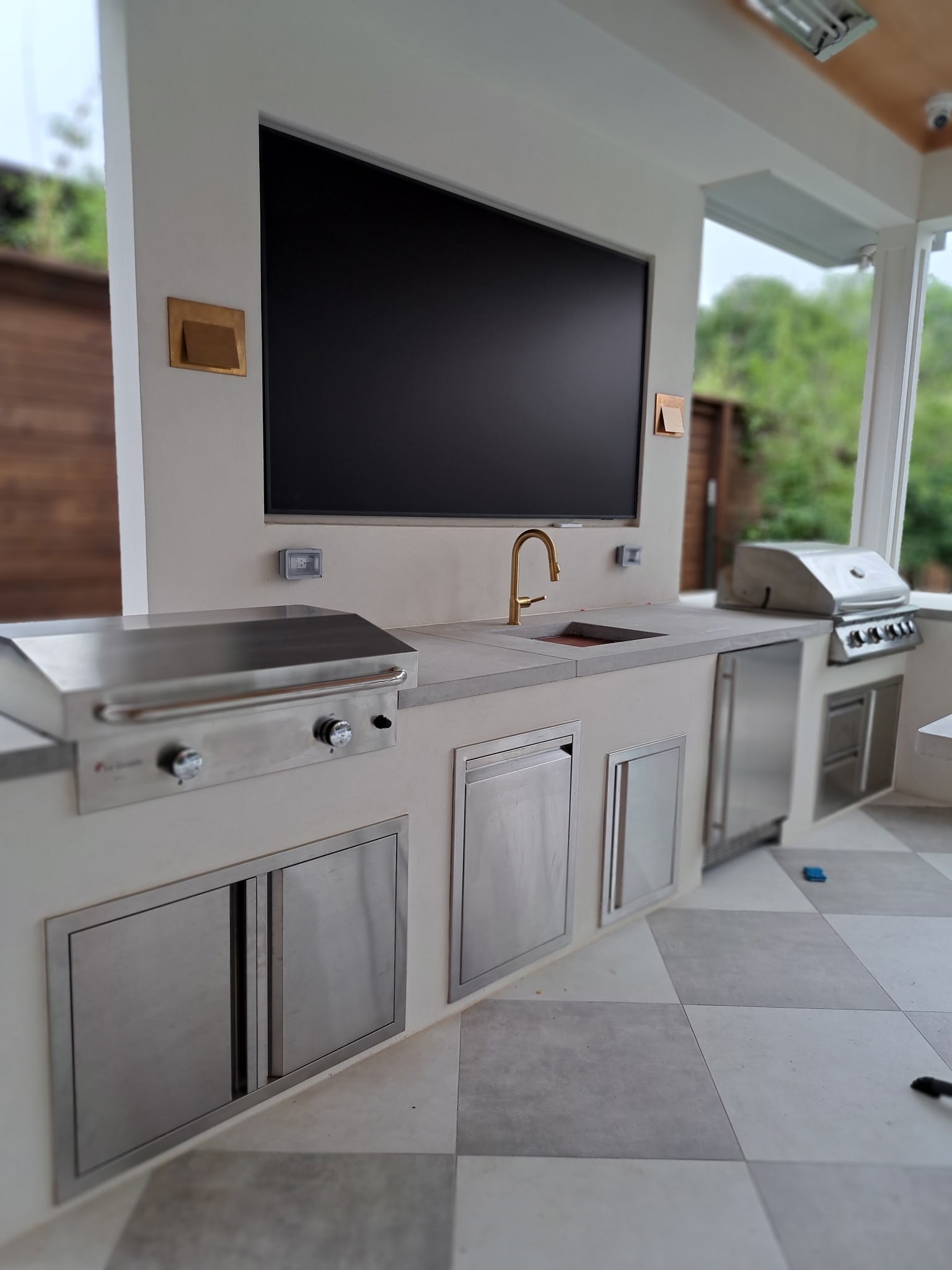 Custom outdoor kitchen and covered patio renovation